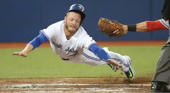  ?? TOM SZCZERBOWS­KI/GETTY IMAGES FILE PHOTO ?? Acrobatic slides, walk-off homers, spectacula­r defence at the hot corner. Blue Jay Josh Donaldson put it all together and walked off with the American League MVP award on Thursday.