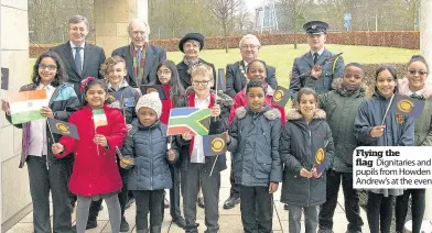  ??  ?? Flying the flag Dignitarie­s and pupils from Howden St Andrew’s at the event