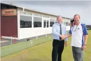  ??  ?? Bowled over Ian Hyslop of Caledonian Windows with Andy Smart, president of Maidens Bowling Club
