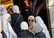  ?? — AFP ?? Women queue outside a Louis Vuitton store in Istanbul. The Turkish lira has nosedived against the dollar.