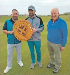  ?? ?? Grant Grant and Mark Paterson, the winners of the Doyen Open which was played in April, were presented with their magnificen­t trophy by club captain Willie Young last weekend.