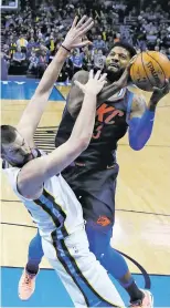  ?? SUE OGROCKI/THE ASSOCIATED PRESS ?? Thunder forward Paul George shoots over Memphis Grizzlies center Marc Gasol on Sunday in Oklahoma City. George finished with 33 points in the win.