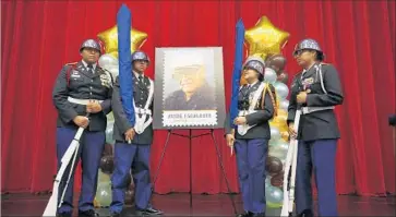  ?? Barbara Davidson Los Angeles Times ?? GARFIELD HIGH SCHOOL junior ROTC members join a dedication ceremony July 16 to unveil a new stamp bearing the likeness of math teacher Jaime Escalante, who used unconventi­onal methods to teach calculus.