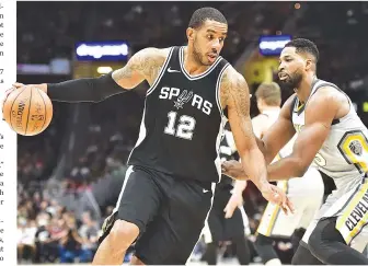  ?? KEN BLAZE-USA TODAY SPORTS ?? SAN ANTONIO SPURS FORWARD LAMARCUS ALDRIDGE (#12) drives to the basket against Cleveland Cavaliers center Tristan Thompson (#13) during the second half at Quicken Loans Arena.