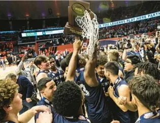  ?? VINCENT D. JOHNSON/DAILY SOUTHTOWN ?? DePaul Prep celebrates after beating Mount Carmel in the Class 3A state championsh­ip game Saturday at the State Farm Center in Champaign.