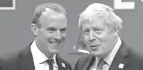  ?? FRANK AUGSTEIN/AP FILE ?? British Prime Minister Boris Johnson, right, and Foreign Secretary Dominic Raab are beset with criticism for stating that Britain wants to keep pursuing trade links with China and other countries with poor human rights records.