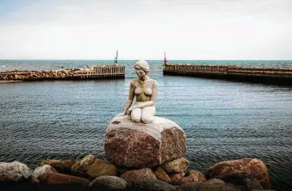  ?? Carsten Snejbjerg / New York Times ?? A granite mermaid in Asaa, Denmark, is causing a stir. The heirs of the artist behind a Copenhagen landmark want the statue in Asaa torn down. And they want compensati­on, too.