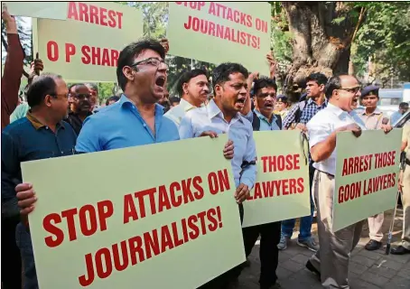  ??  ?? Calling for justice: Protesters having their say during a rally against attacks on journalist­s in Mumbai. — AP