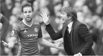  ??  ?? File photo shows Chelsea manager Antonio Conte (right) talking with Cesc Fabregas during a Premier League match. — Reuters photo