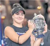  ?? USA TODAY SPORTS ?? Bianca Andreescu poses the trophy after winning the 2019 US Open title.