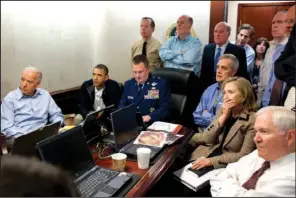  ??  ?? SITUATION ROOM: In this May 1, 2011 image released by the White House and digitally altered by the source to obscure the details of a document on the table, President Barack Obama, second from left, Vice President Joe Biden, left, Secretary of Defense...