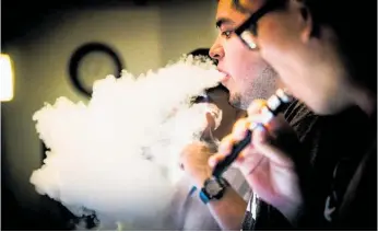  ?? Photo / Getty Images ?? Vaping involves inhaling a vapour from a battery-powered electronic cigarette.