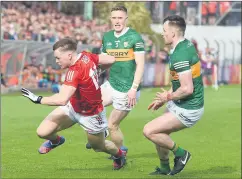  ?? Hatchell) (Pic: George ?? GOOD SHOWING FROM CATHAL - Cork and Mitchelsto­wn’s Cathal O’Mahony in possession breaks past the challenge of Kerry duo Jason Foley and Tom O’Sullivan in the Munster Senior Football Championsh­ip semi-final at Páirc Uí Rinn. Kerry emerged victorious 0-11 to 0-23, with Cathal scoring 0-3 for the Rebels.