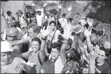  ?? EPA ?? Villagers who were trapped in the fighting between Islamist militants and government forces jubilate following their succesful escape to freedom in Marawi City.