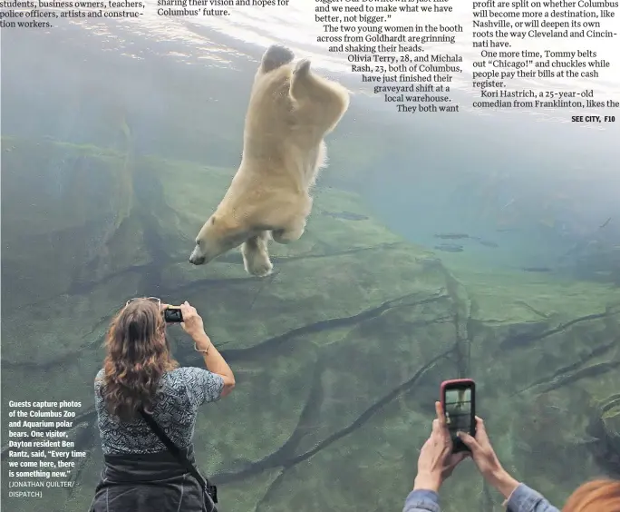 ?? [JONATHAN QUILTER/ DISPATCH] ?? Guests capture photos of the Columbus Zoo and Aquarium polar bears. One visitor, Dayton resident Ben Rantz, said, “Every time we come here, there is something new.”