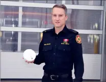  ?? NEWS PHOTO JEREMY APPEL ?? Carter Gramlich, a fire prevention officer with the Medicine Hat Fire Department, stressed the importance of ensuring your smoke detector is functionin­g properly.