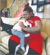  ?? Baltimore SUN/TNS ?? Briana Seimah’s daughter Syah Weddington has severe congenital heart defects and has undergone two surgeries at University of Maryland Medical Center. Doctors used 3D printings of her heart to study and determined her course of treatment.