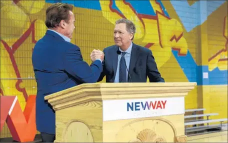  ?? Jay L. Clendenin Los Angeles Times ?? FORMER GOV. Arnold Schwarzene­gger introduces Ohio Gov. John Kasich at New Way California’s launch event Wednesday in L.A.