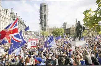  ?? (AP) ?? Anti-Brexit supporters gather in Parliament Square after a protest march in London on Oct 19.
Britain’s Parliament is set to vote in a rare Saturday sitting on Prime Minister Boris Johnson’s new deal with the European Union, a decisive moment in the prolonged bid to end the Brexit stalemate.
Various scenarios may be put in motion by the vote.