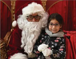  ?? Photo by Domnick Walsh ?? Santa’s little helper: Martha Dunova from Tralee was one of the first children to meet Santa when he arrived at Manor West over the weekend.