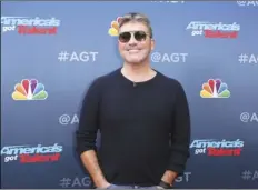  ?? PHOTO BY WILLY SANJUAN/INVISION/AP ?? In this March 11 file photo, Simon Cowell arrives at the “America’s Got Talent” Season 14 Kickoff at the Pasadena City Auditorium in Pasadena, Calif.
