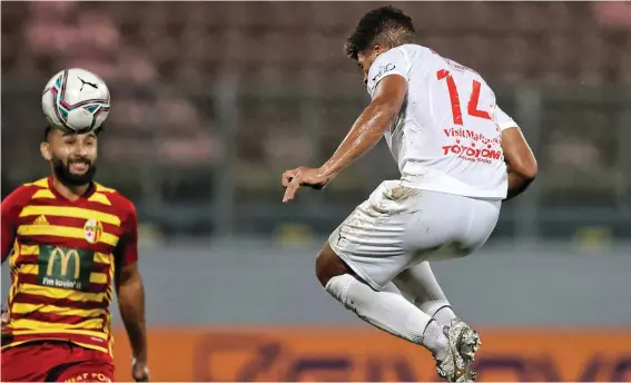  ??  ?? Valletta's Kyrian Nwoko (R) picks his spot to score with a thumping header during the first half and put his side into a 2-1 lead against Birkirkara. Photo © Domenic Aquilina