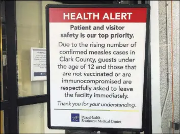  ?? Gillian Flaccus The Associated Press ?? A sign prohibitin­g all children under 12 and unvaccinat­ed adults stands Friday at the entrance to PeaceHealt­h Southwest Medical Center in Vancouver, Wash.