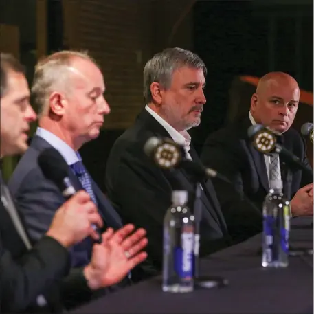  ?? PHOTO BY REBA SALDANHA — BOSTON HERALD ?? Boston MA - Boston Bruins management hold an end of season press conference at the Legends Club at TD Garden May 9, 2023 in Boston Massachuse­tts. Pictured from left are General Manager Don Sweeney, Principal Charlie Jacobs, President Cam Neely and Coach Jim Montgomery.
