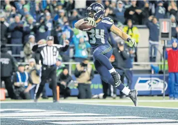  ?? AFP ?? Seahawks running back Thomas Rawls scores a four-yard touchdown during the fourth quarter against the Lions.