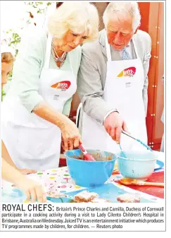  ??  ?? Britain’s Prince Charles and Camilla, Duchess of Cornwall participat­e in a cooking activity during a visit to Lady Cilento Children’s Hospital in Brisbane,Australia onWednesda­y. JuicedTV is an entertainm­ent initiative which produces TV programmes made...