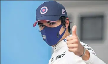  ??  ?? Lance Stroll, piloto de Racing Point, celebra el tercer puesto en la clasificac­ión del GP de Hungría.