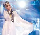  ??  ?? All that glitters: The Malaysian superstar wrapped up her set with a mesmerizin­g performanc­e of Come Back, her latest single.
Photo by MTV ASIA & ALOYSIUS LIM