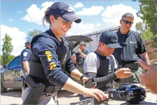  ?? GABRIELA CAMPOS/THE NEW MEXICAN ?? Dominique Romero reloads her gun alongside fellow SFPD pre-academy cadets as they take part in firearm training Wednesday.