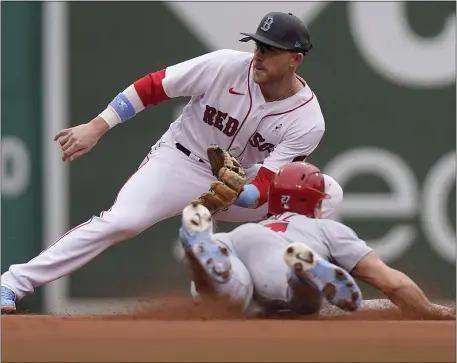  ?? STEVEN SENNE — THE ASSOCIATED PRESS ?? St. Louis Cardinal runner Tyler O’Neill attempts to steal second as Boston’s Trevor Story prepares to tag him during a June 19, 2022 game in Boston. Both are keys to the Red Sox lineup.