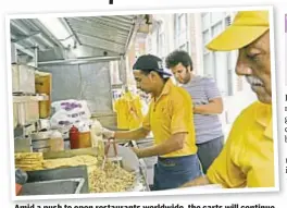  ??  ?? Amid a push to open restaurant­s worldwide, worldwide the carts will continue serving dishes like the chicken, lamb, rice and salad combo (below)