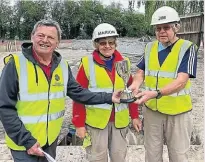  ?? PHOTO: PHIL PICKIN ?? Marion and Jim Weir being presented with the Tetlow Memorial Cup by Michael Haig, chairman of the Shrewsbury & North Wales branch of the IWA.