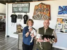  ?? ?? GoatCountr­y owner Josh Keeton and his wife, Cassie, with a couple of four-legged friends. Keeton said he loves “seeing on a daily basis how this company and all of these animals have changed our lives.”