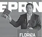  ?? JOE RAEDLE/ GETTY IMAGES ?? Florida Gov. Ron DeSantis has scored political points by waging a war against corporate “wokeness.”