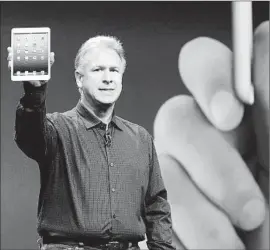  ?? Kevork Djansezian
Getty Images ?? APPLE EXECUTIVE Phil Schiller introduces the iPad mini, a smaller, lessexpens­ive alternativ­e to the iPad tablet, at a San Jose event in October 2012.