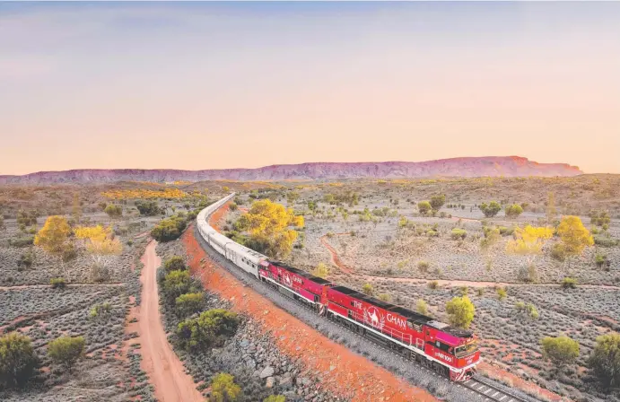  ??  ?? The Ghan train in the Outback.