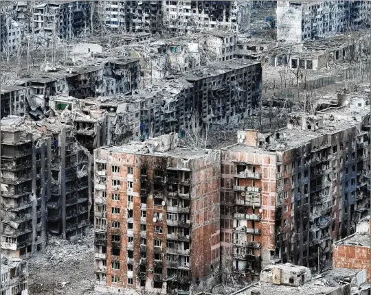  ?? TYLER HICKS/THE NEW YORK TIMES ?? An aerial drone image shows Bakhmut, in eastern Ukraine, on May 19. The Russians are declaring victory in this battle, the war’s longest and bloodiest. The Ukrainians, making gains on the outskirts, say the death of the city is not the end of the campaign to drive the Russians from the ruins.