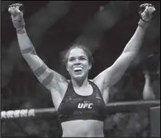  ?? Associated Press ?? REIGNING CHAMP — Amanda Nunes, seen celebratin­g a win in December, defeated Felicia Spencer to retain her featherwei­ght belt in UFC 250 on Saturday in Las Vegas.