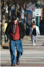  ?? STAFF FILE PHOTO BY DOUG STRICKLAND ?? Ron Gray walks along Market Street on a chilly January morning.