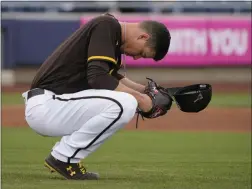  ?? SUE OGROCKI ?? San Diego Padres pitcher Mackenzie Gore pauses behind the mound before pitching in the first inning of a spring training baseball game against the Cincinnati Reds, Tuesday, March 23, 2021, in Peoria, Ariz.