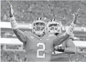  ?? Streeter Lecka / Getty Images ?? Clemson quarterbac­k Kelly Bryant, left, stood tall after throwing for 252 yards and a touchdown and rushing for a score in Saturday’s rout of Miami.