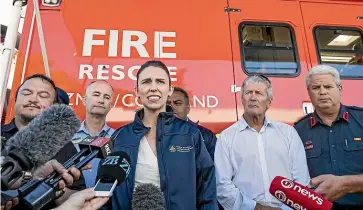 ?? BRADEN FASTIER/ STUFF ?? Prime Minister Jacinda Ardern visits a forward command centre in Pigeon Valley.