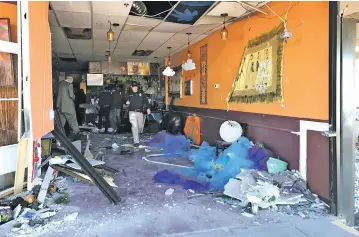  ??  ?? Jambo Café was extensivel­y damaged Thursday when a Subaru driven by an 81-year-old woman plowed into the restaurant during the lunch hour. The vehicle came to a stop 25 feet into the cafe, where more than 30 people had been dining.