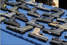  ?? DAKOTA SANTIAGO — THE NEW YORK TIMES ?? “Ghost guns” — kits that can be bought online and assembled into untraceabl­e homemade firearms — line a display during a New York Police Department news conference in 2022.