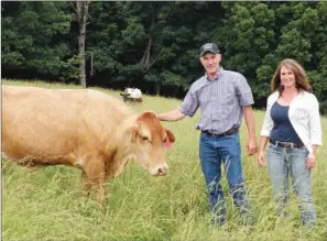  ?? CAROL ROLF/CONTRIBUTI­NG PHOTOGRAPH­ER ?? Mark and Jackie Martin of Timbo raise cattle and hay on their 867-acre farm.