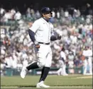  ?? AP photo ?? Miguel Cabrera of the Tigers runs to first base after being intentiona­lly walked in the eighth inning Thursday. Cabrera is one hit away from becoming the 33rd player to reach 3,000 hits in Major League Baseball history.